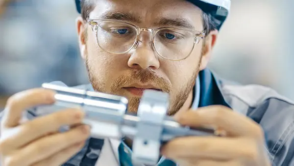 Worker inspects product
